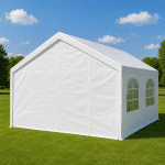 White event tent on a green lawn under a blue sky with scattered clouds side panels visible with arched windows
